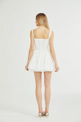 White lace corset mini dress with floral pattern and adjustable straps called Camille