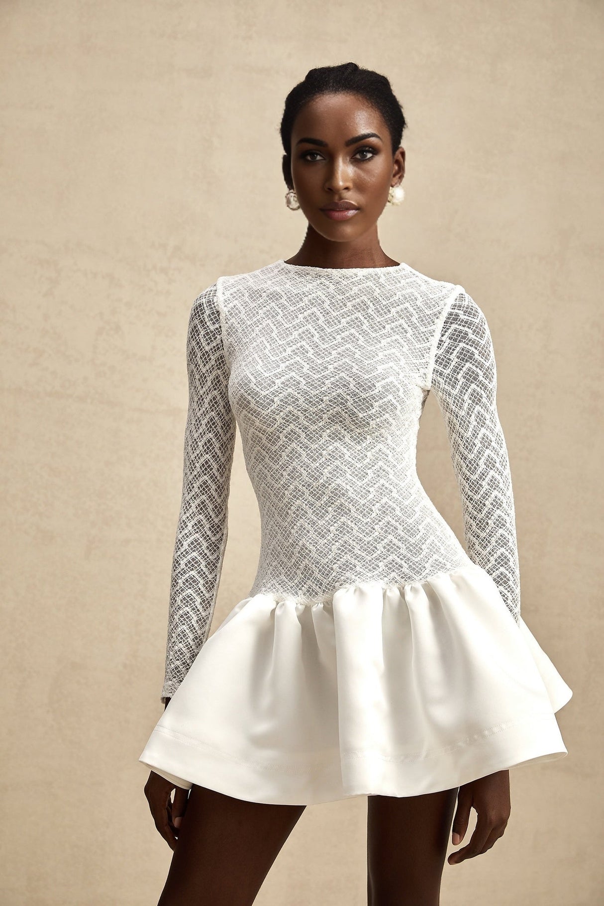 White lace mini dress with panel details and short length