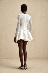 White lace mini dress with panels featuring a delicate ocean inspired design