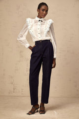 White lace trimmed semi sheer shirt called Capucine on a plain background