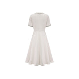 White midi dress with crystal accents and bow detail named Cassiopeia