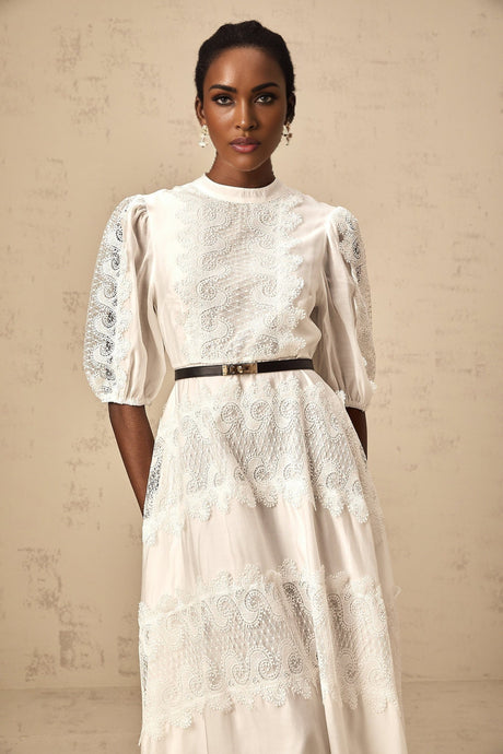 White midi dress with lace trim panels and belt at waist