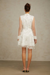 White mini dress with 3D floral petal details on tulle fabric named Camille