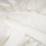 White mini dress with a bubble skirt called Elodie featuring a short length and voluminous lower half