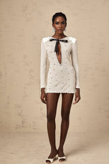 White mini dress with cutout design and bowknot embellishment