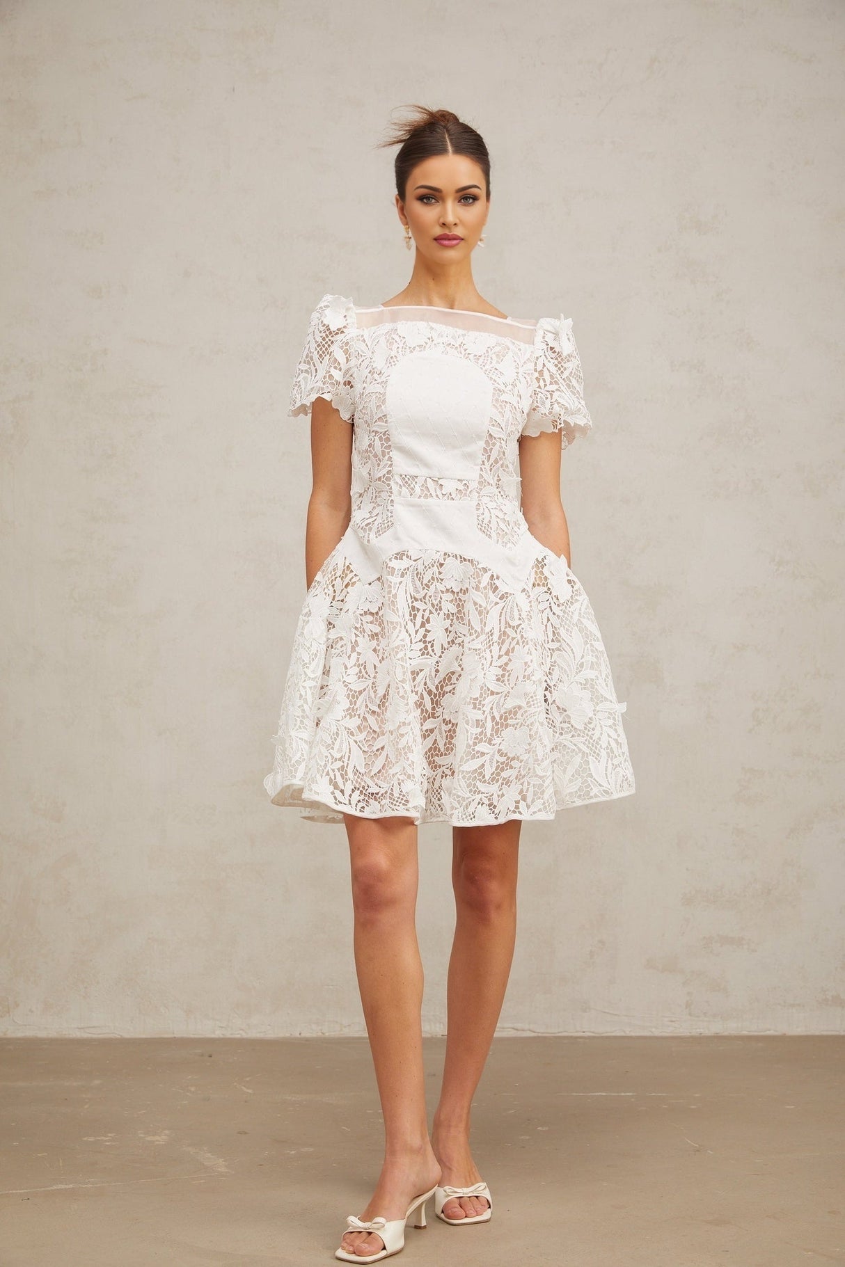 White mini dress with floral lace pattern and puff sleeves Josette design