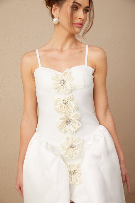 White mini dress with floral pattern and bustier style top