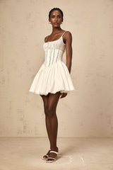 White mini dress with lace details and corset style bodice