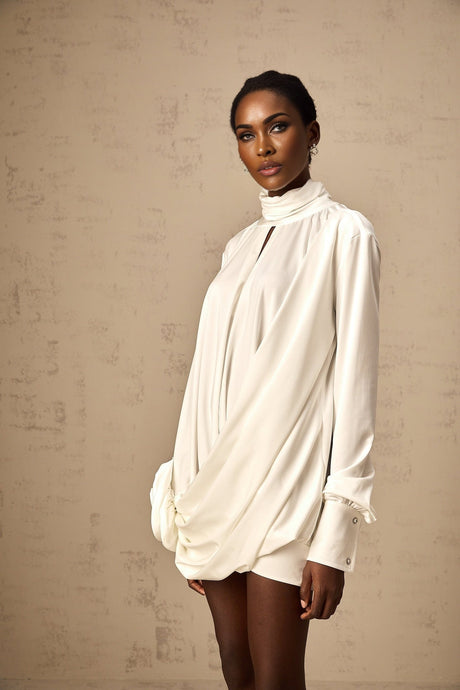 White mini dress with ruched detailing and faux flower embellishments named Maeva