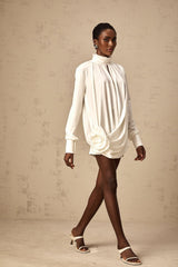 White mini dress with ruched details and faux flower embellishments called Maeva