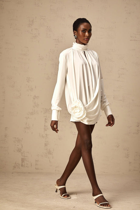 White mini dress with ruched details and faux flower embellishments called Maeva