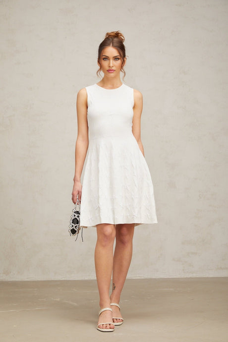 White mini dress with star pattern knit fabric and jasmine design elements