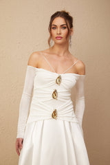 White offshoulder maxi dress with panelled design worn by model