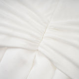 White offshoulder maxi dress with panels worn by model
