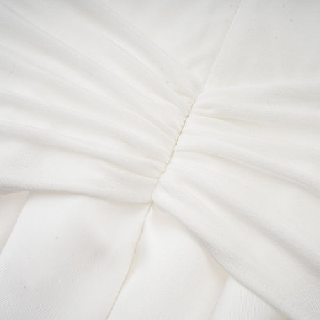White offshoulder maxi dress with panels worn by model