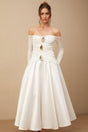 White offshoulder maxi dress with panels worn by model