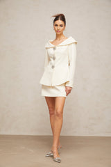 White peplum jacket and matching skirt set named Eugenie