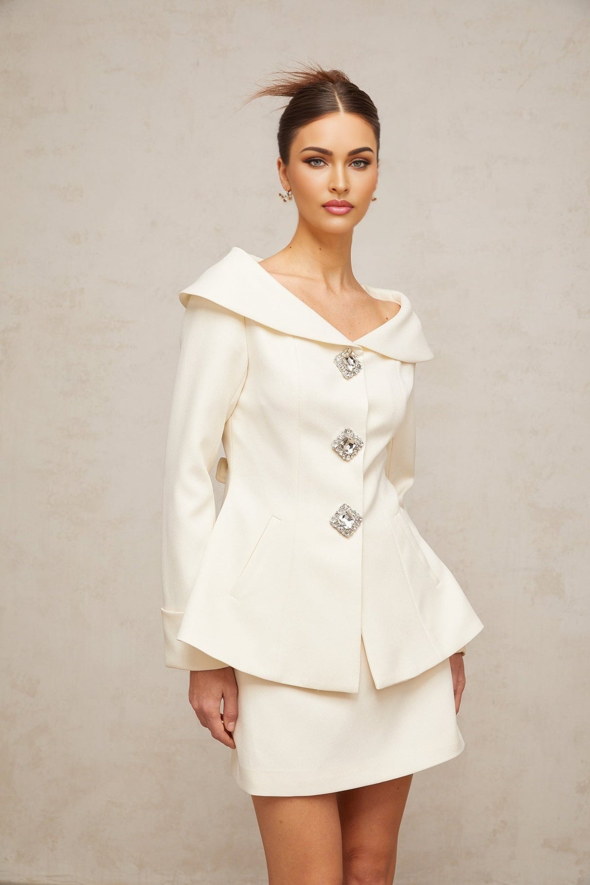 White peplum jacket and matching skirt set named Eugenie