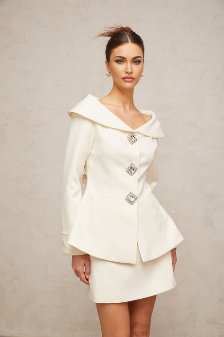 White peplum jacket and matching skirt set named Eugenie
