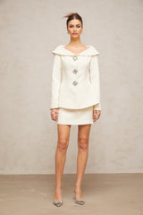 White peplum jacket and matching skirt set named Eugenie