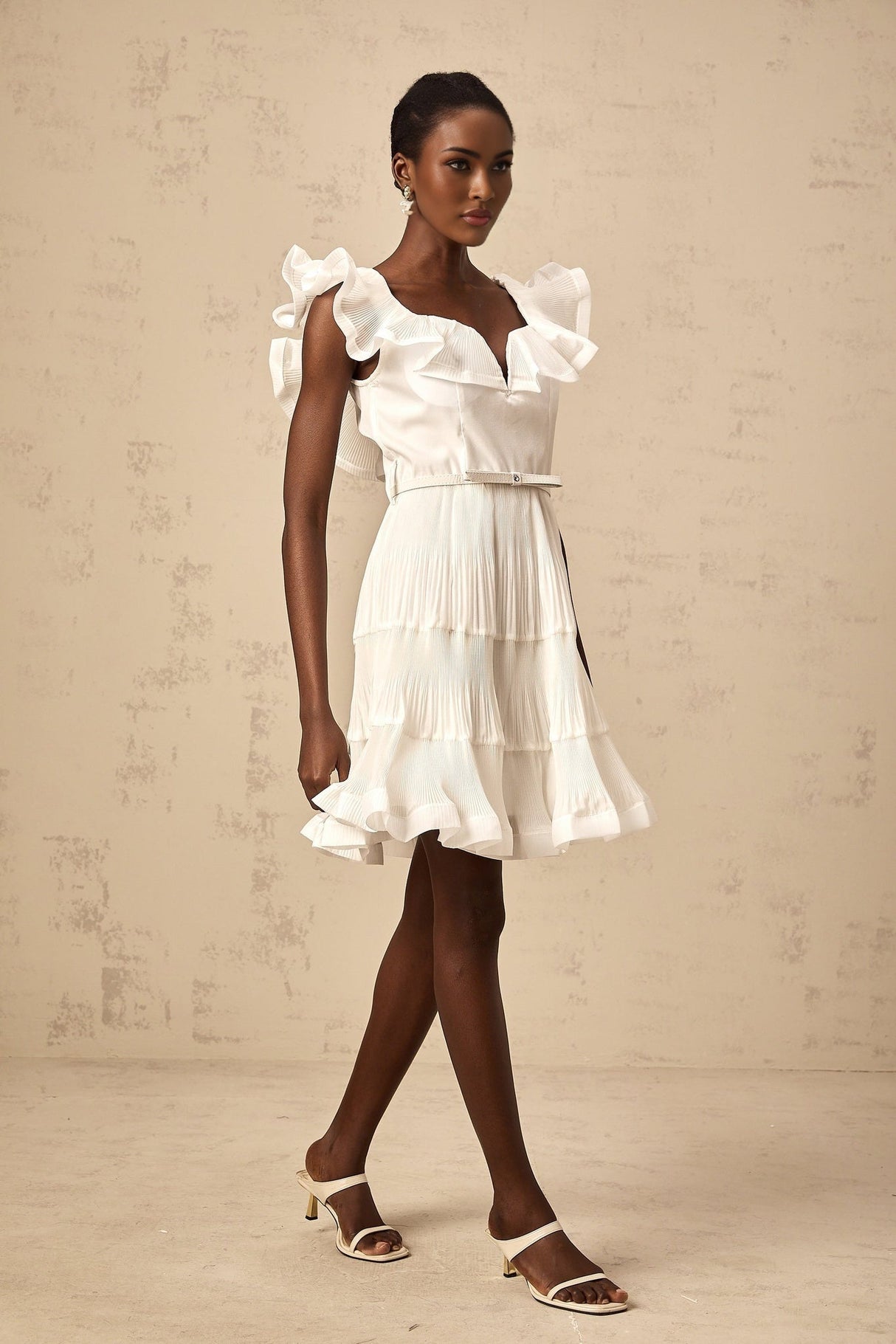 White pleated mini dress with frilled neckline named Eliane