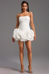 White Rakani Sleeveless Fold Bud Mini Dress with strapless neckline and pleated detailing