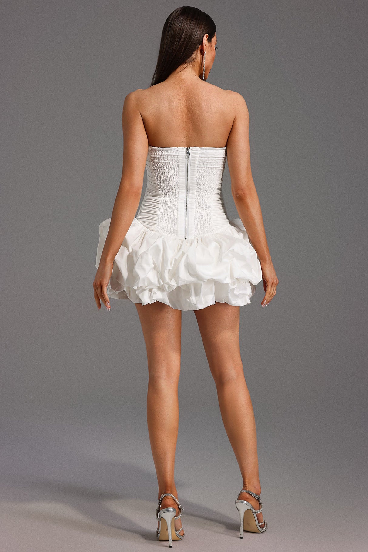 White Rakani Sleeveless Fold Bud Mini Dress with Strapless Neckline and Ruffle Hem