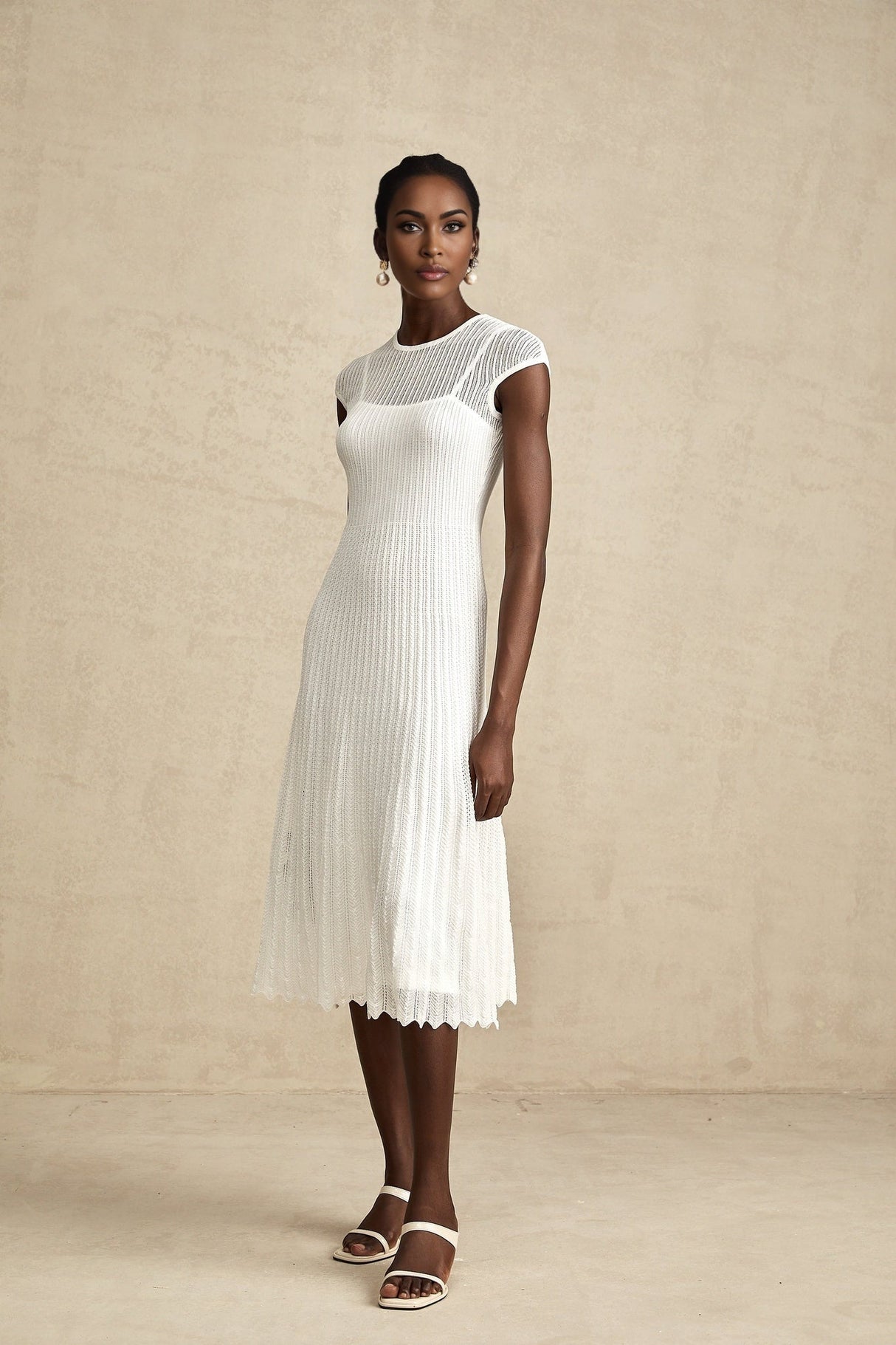 White semi sheer midi dress with scalloped hem called Liane