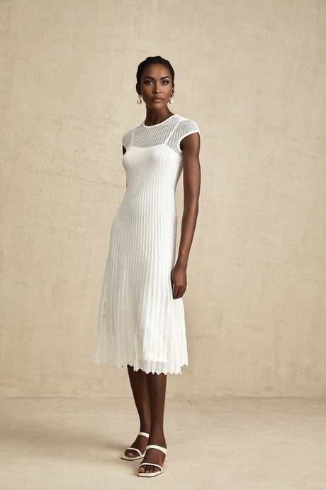 White semi sheer midi dress with scalloped hem called Liane