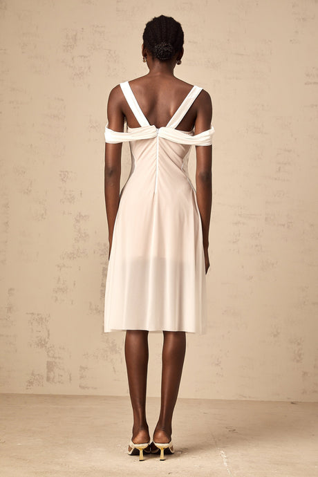 White semi sheer ruched midi dress on a mannequin or model