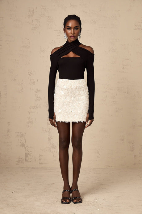 White sequined mini skirt with shimmering texture and short length