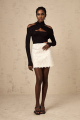 White sequined mini skirt with shimmering texture and short length