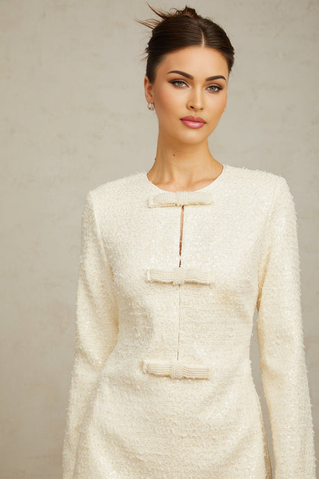 White sequined tweed mini dress with short sleeves and a classic silhouette