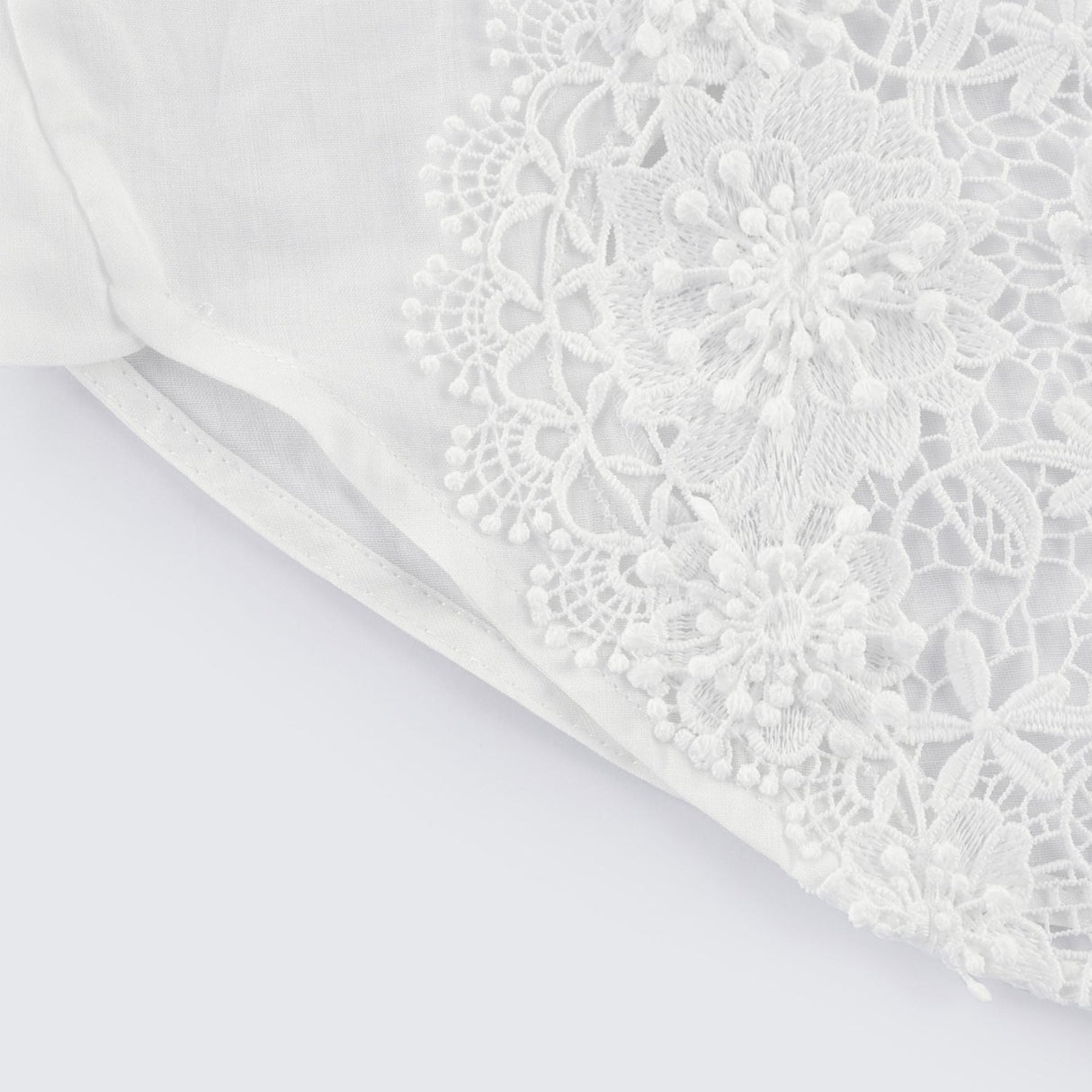 White shirt with lace embroidery and cut out details
