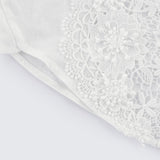 White shirt with lace embroidery and cut out details