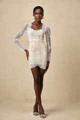 White short lace dress with scalloped hem and delicate floral pattern