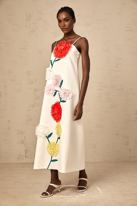 White sleeveless midi dress with three dimensional petal details on the bodice