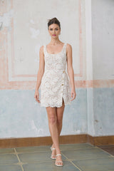 White sleeveless mini dress featuring corded lace design with a floral pattern named Anastasie