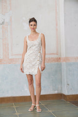 White sleeveless mini dress with corded lace details called Anastasie
