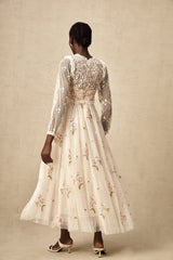 White tulle midi dress with delicate floral embroidery featuring long sleeves and a high neckline from Celine