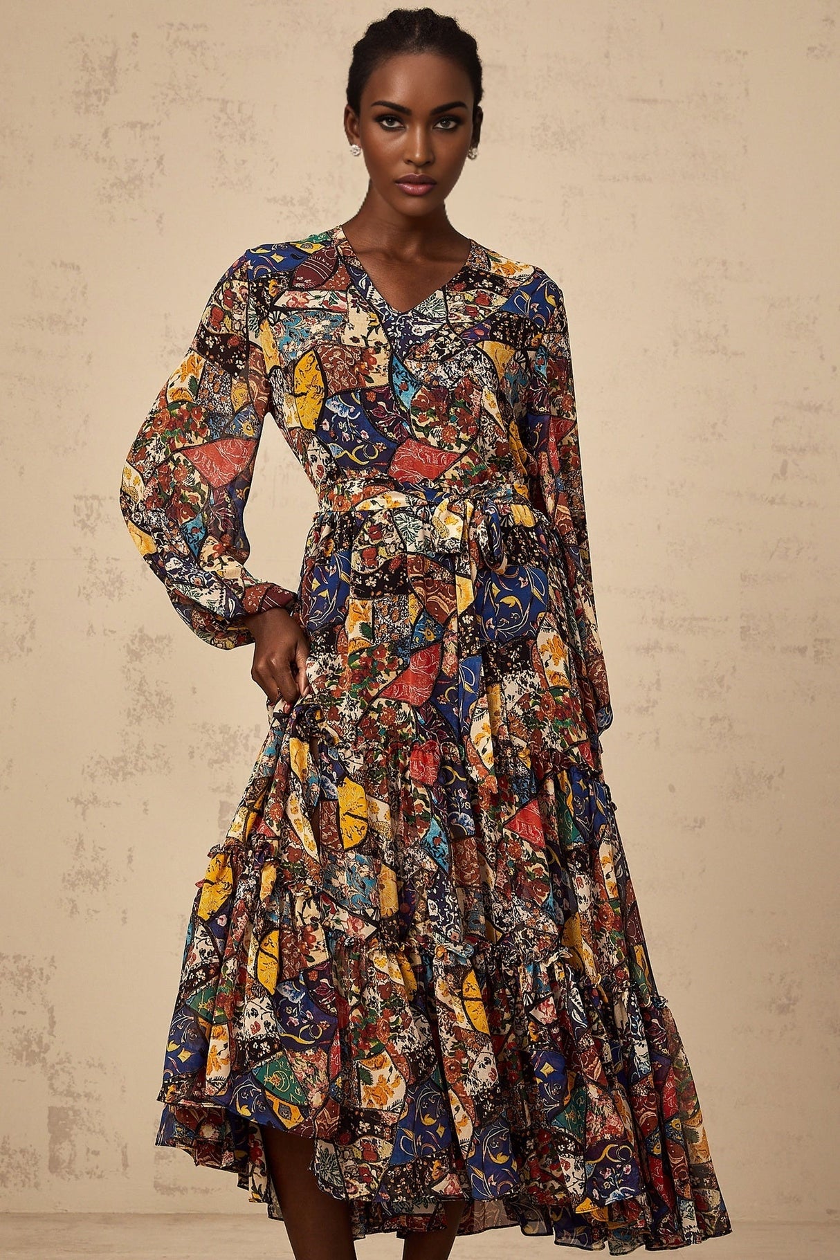 Woman wearing a brown bohemian style midi dress with shirring details and flowing fabric