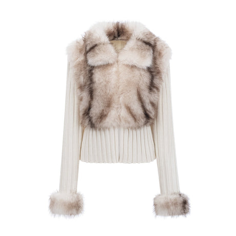 Woman wearing a cozy beige faux fur jacket with ribbed knit sleeves and collar