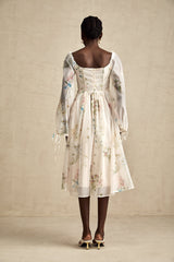 Woman wearing a floral print midi dress with square neckline and Anne design