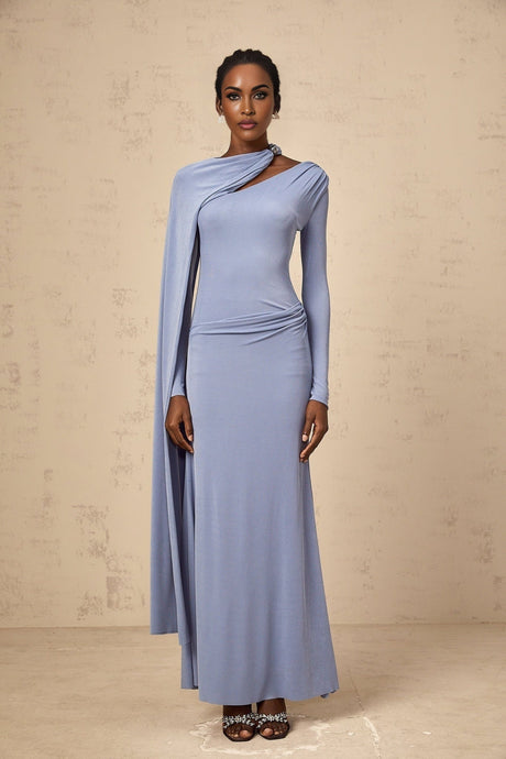 Woman wearing a long blue fitted maxi dress with diagonal shawl neckline