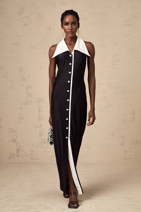 Woman wearing a long fitted maxi dress with colorblocked design in contrasting colors