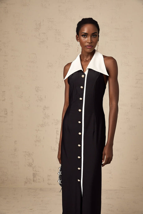 Woman wearing a long fitted maxi dress with colorblocked design in contrasting shades