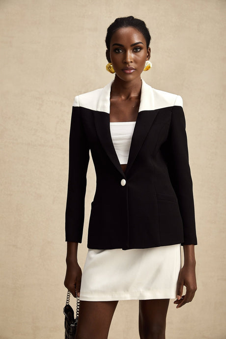 Woman wearing a matching jacket and skirt set with contrasting colors by Honorine