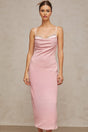 Woman wearing a pink midi dress with crystal embellishments and corsetstyle bodice