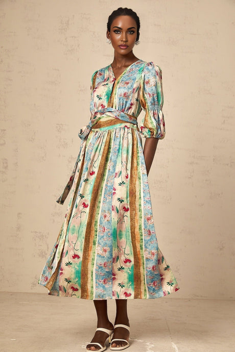 Woman wearing a red floral print wrap style midi dress with short sleeves and v neckline
