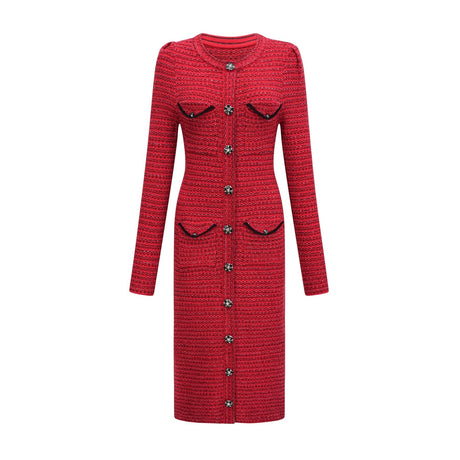 Woman wearing a red knit midi dress with embellishments standing in a neutral background
